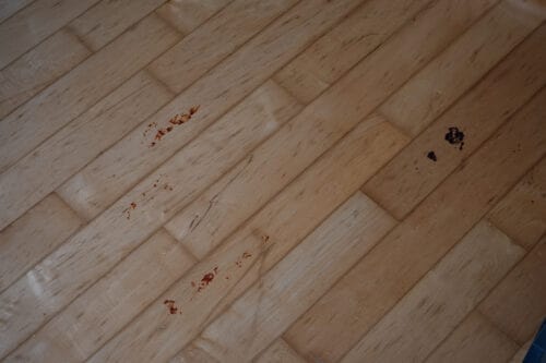 Tomato sauce and chocolate cake on a hard wood floor that the Xiaomi Mi Robot Vacuum Mop 1C wasn't able to clean.