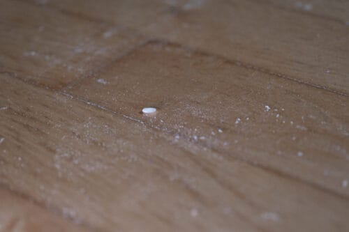 Leftover flour and rice on a hard wood floor after being cleaned by the Xiaomi Mi Robot Vacuum Mop 1C