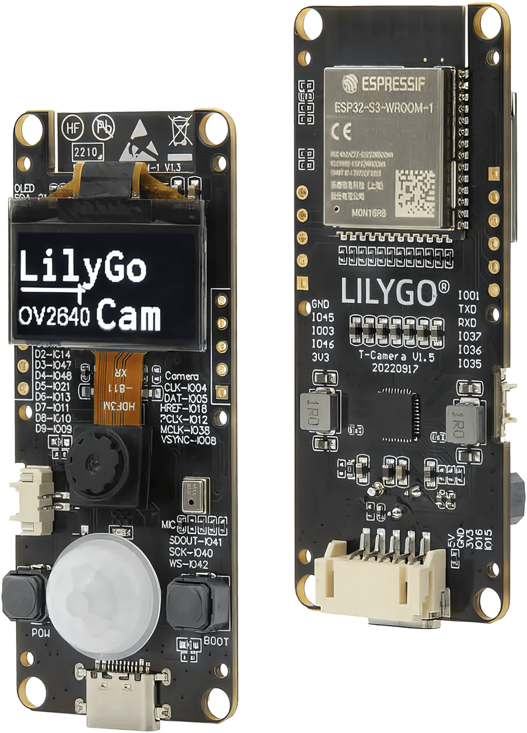 A sleek, compact black LILYGO T-Camera S3 with a high-resolution OV2640 camera lens and a small OLED screen, accompanied by visible microprocessor and memory chips.